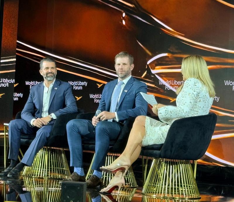 Donald Trump Jr. and Eric Trump on stage at World Liberty Financial event
