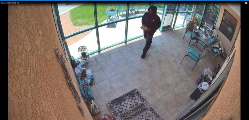 Ferro using a brick to break into a victim's home